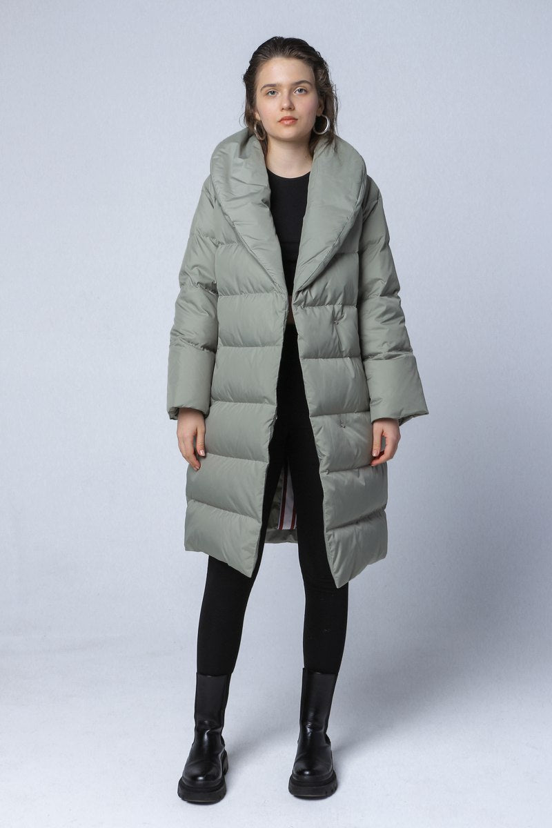 Longline down coat in a soft green color