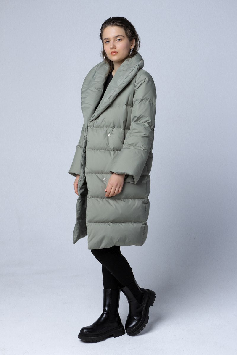 Longline down coat in a soft green color